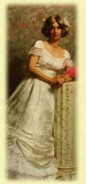 Woman in a white vintage dress holding flowers, leaning on a decorative column.