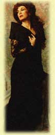 Woman in an elegant black dress with a dramatic pose.